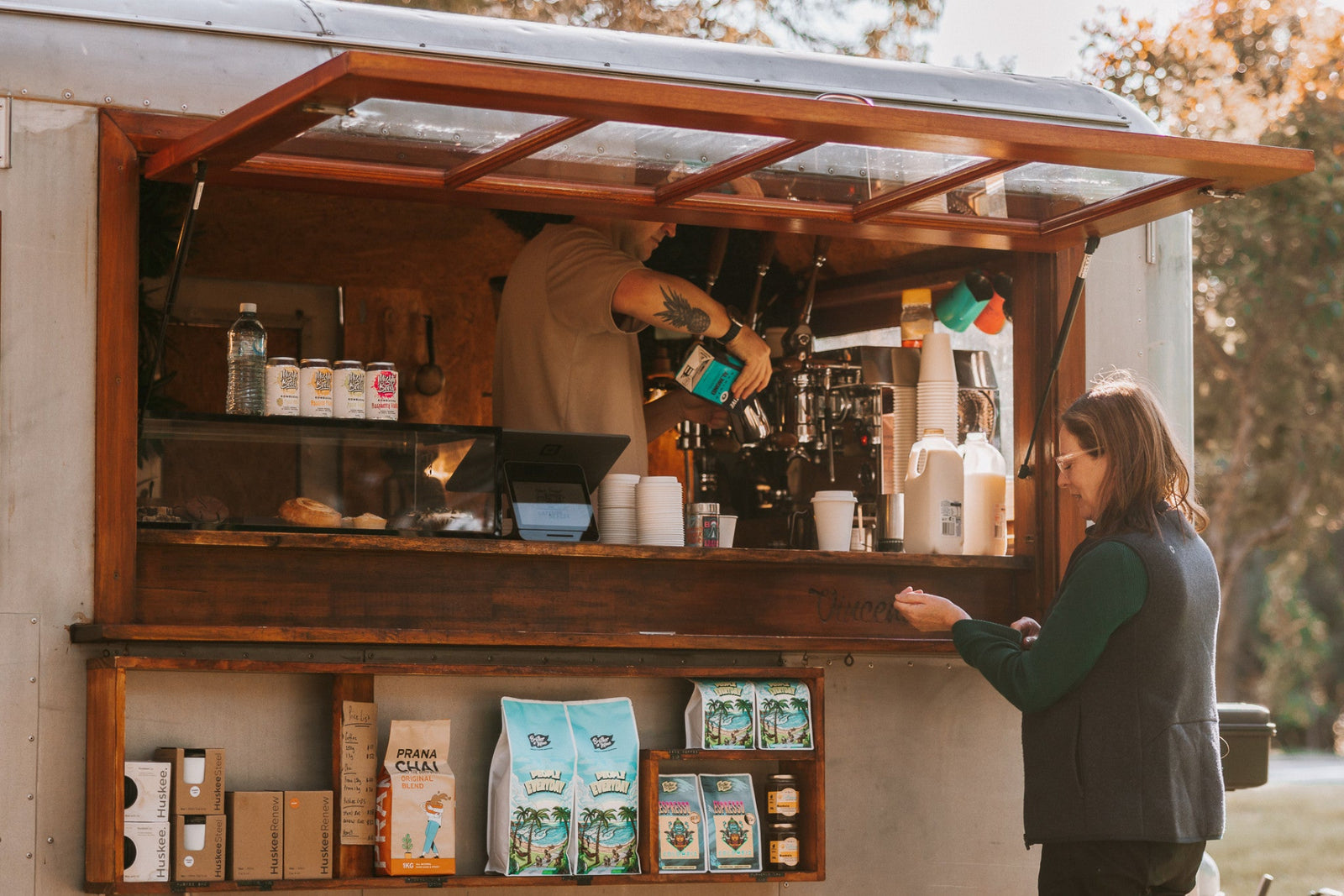 Wholesale coffee partner Vincent the Van serving a customer specialty coffee at Silver Sands, Western Australia