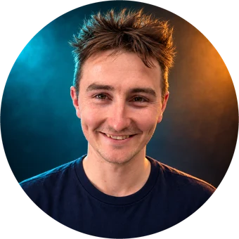 Dan, smiling, in a navy tee